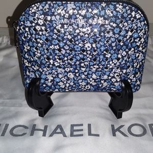 Blue floral perforated Michael Kors cosmetic bag
